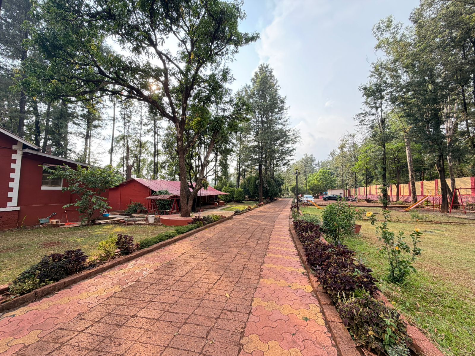 Tree lined pathway in hotel garden